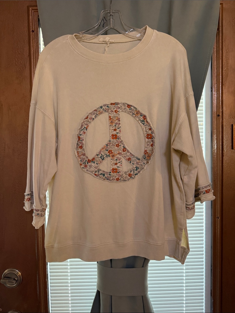 Cream color top by easel size small. Oversize fit